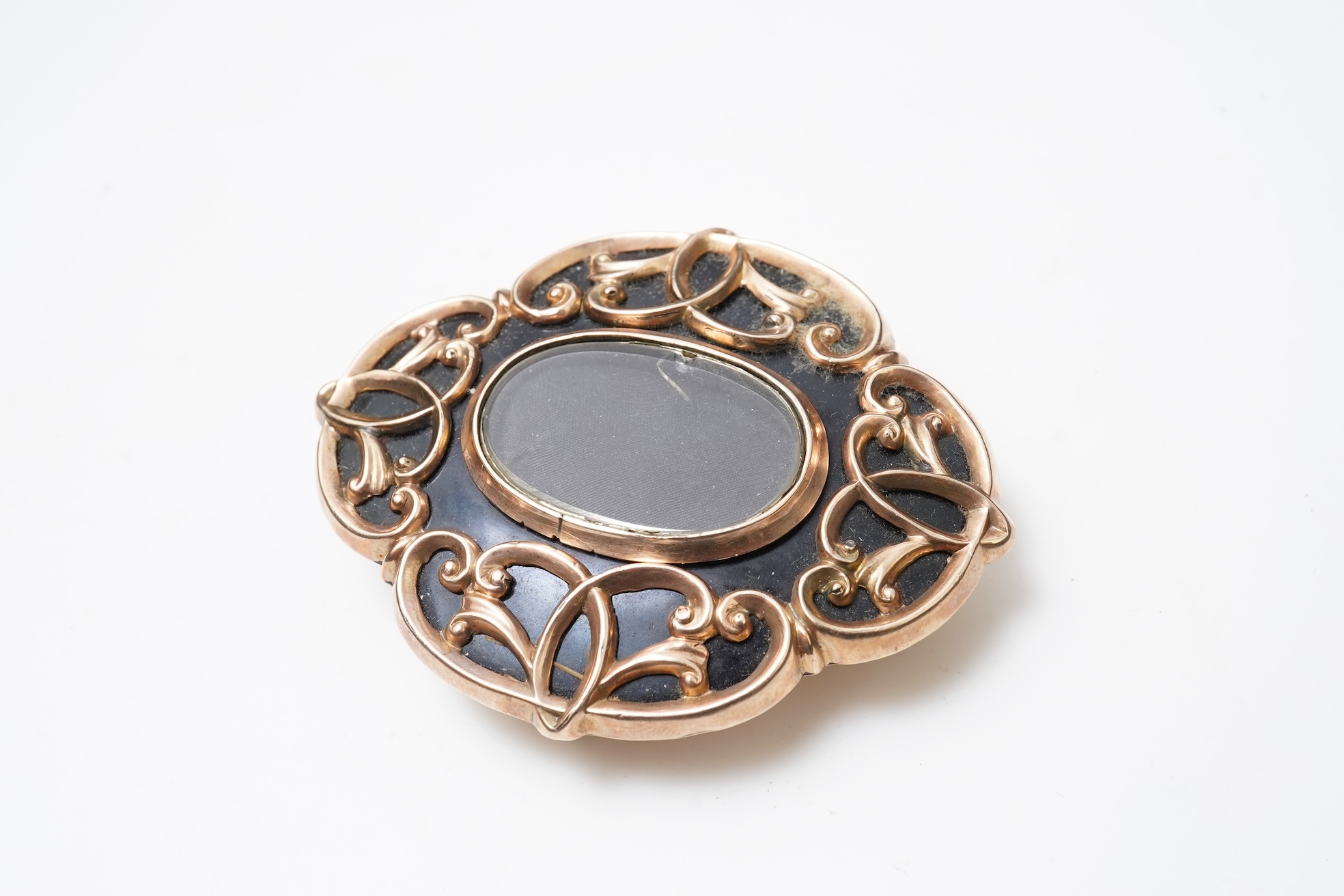 A Victorian rolled gold and enamel locket brooch/pendant, late 19th century